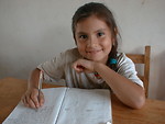 Free Stock Photo: Girl with notebook in new class room provided by the Solar.net Village project.